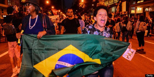 RIO DE JANEIRO, BRAZIL - JUNE 27: Protesters march after the death of a young man during a protest in Belo Horizonte on June 27, 2013 in Rio de Janeiro, Brazil. (Photo by Marcelo Fonseca/Brazil Photo Press/LatinContent/Getty Images)