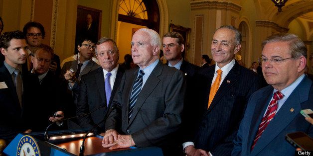 UNITED STATES - June 27: Sen. Dick Durbin, D-Ill., Sen. John McCain, R-AZ.,Sen. Michael Bennet, D-Colo., Sen. Charles Schumer, D-N.Y., and Sen. Robert Menendez, D-N.J. five of the authors of the immigration reform bill crafted by the Senate's bipartisan 'Gang of Eight,' during a press conference on Capitol Hill in Washington, Thursday, June 27, 2013, after the final vote in the Senate on immigration reform. The Senate passed historic immigration legislation that would dramatically remake the U.S. immigration system and require a tough new focus on border security. (Photo By Douglas Graham/CQ Roll Call)