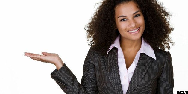 Mixed race businesswoman showing copy space 