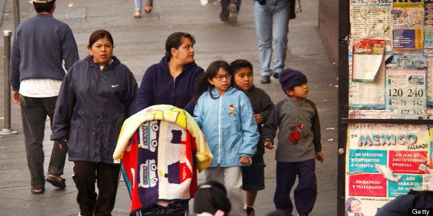 LOS ANGELES, CA - JANUARY 22: A group of women and children walk down a street in a predominantly Latin American immigrant section of the community of Westlake on January 22, 2003 in Los Angeles, California. According to census figures released this week, Hispanics are surging past African Americans as the largest minority in the United States. (Photo by David McNew/Getty Images) 