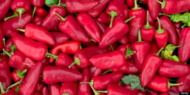 A large pile of Red Hot Jalapeno Chili Peppers at the farmers market at pike place market in seattle