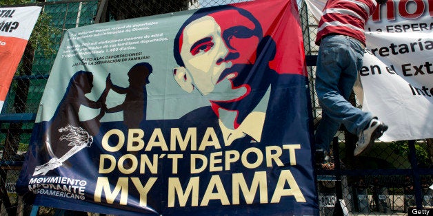 A member of the Meso-American Migrant Movement hangs banner in front of the US embassy in Mexico City during a protest to demand the deportation of Mexicans from the US to stop, on May 2, 2013. Migration will be among the top issues when US President Barack Obama visits Mexico and Costa Rica this week, and many in the region hope Washington will finally act to give 11 million undocumented workers a path to citizenship. Obama headed to Mexico on Thursday to put trade back at the heart of bilateral ties, but his southern neighbour's shifting drug war tactics loom large over the visit. AFP PHOTO / Yuri CORTEZ (Photo credit should read YURI CORTEZ/AFP/Getty Images)