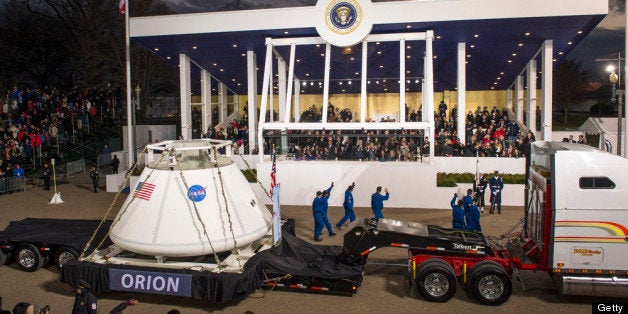 WASHINGTON, DC - JANUARY 21: In this handout provided by the National Aeronautic and Space Administration (NASA), the Orion space capsule, along with NASA astronauts Lee Morin, Alvin Drew, Kjell Lindgren, Serena Aunon, Kate Rubins and Mike Massimino pass the presidential viewing stand during the inaugural parade honoring U.S. President Barack Obama January 21, 2013 in Washington, DC. Obama was sworn-in for his second term earlier in the day. (Photo by Bill Ingalls/NASA via Getty Images)