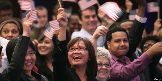 NEW YORK, NY - JULY 26: Newly naturalized American citizens celebrate after taking the Oath of Allegiance to the United States on July 26, 2013 in New York City. Eighty immigrants from 47 countries took part in a naturalization ceremony held at the New York Historical Society. (Photo by John Moore/Getty Images)