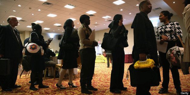 NEW YORK, NY - APRIL 18: Job seekers line up to meet potential employers at a career fair on April 18, 2013 at the Holiday Inn in Midtown in New York City. The event was held by National Career Fairs which expected some 700 job seekers would come to meet 20 potential employers. (Photo by John Moore/Getty Images)