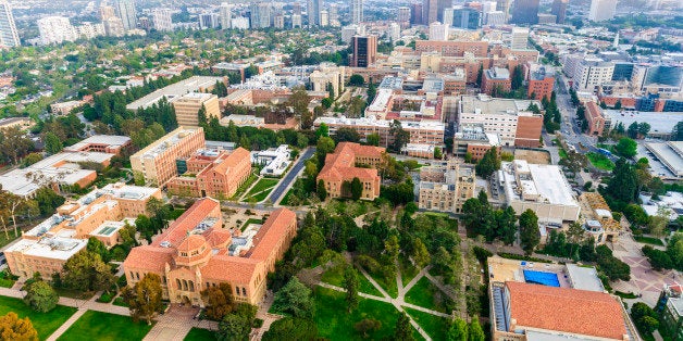 aerial view of campus of University of California in Los Angeles, with smoggy cityscape of Los Angeles, California in the background