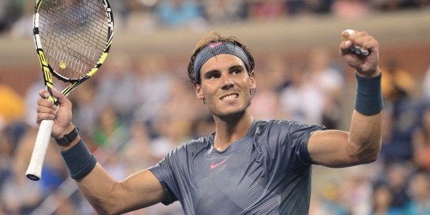 Spanish tennis player Rafael Nadal celebrates victory over Germany's Philipp Kohlschreiber during their 2013 US Open men's si