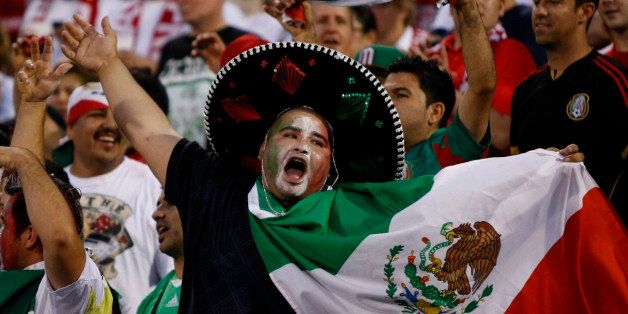 Mexico fans cheer before the start of the Brazil 2014 FIFA World Cup qualifier against USA at Columbus Crew Stadium in Columbus, Ohio, September 10, 2013. USA won 2-0. AFP PHOTO / PAUL VERNON (Photo credit should read Paul VERNON/AFP/Getty Images)