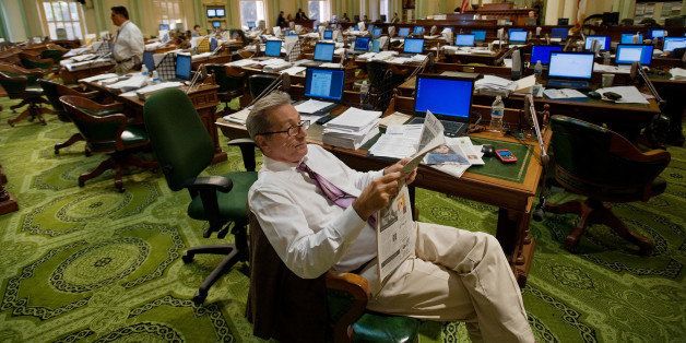 California Asasembly member Tom Ammiano (D-San Francisco) reads the newspaper before work began at the California State Capitol in Sacramento, California, on Friday, July 24, 2009. (Photo by Randall Benton/Sacramento Bee/MCT via Getty Images)