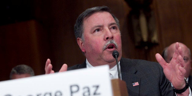 George Paz, chairman and chief executive officer of Express Scripts Inc., speaks during a Senate Judiciary Committee hearing in Washington, D.C., U.S., on Tuesday, Dec. 6, 2011. Express Scripts Inc. and Medco Health Solutions Inc. save tens of billions of dollars in annual drug costs, according to a report released before today's U.S. Senate hearing on the companies' planned $29.1 billion merger. Photographer: Andrew Harrer/Bloomberg via Getty Images 