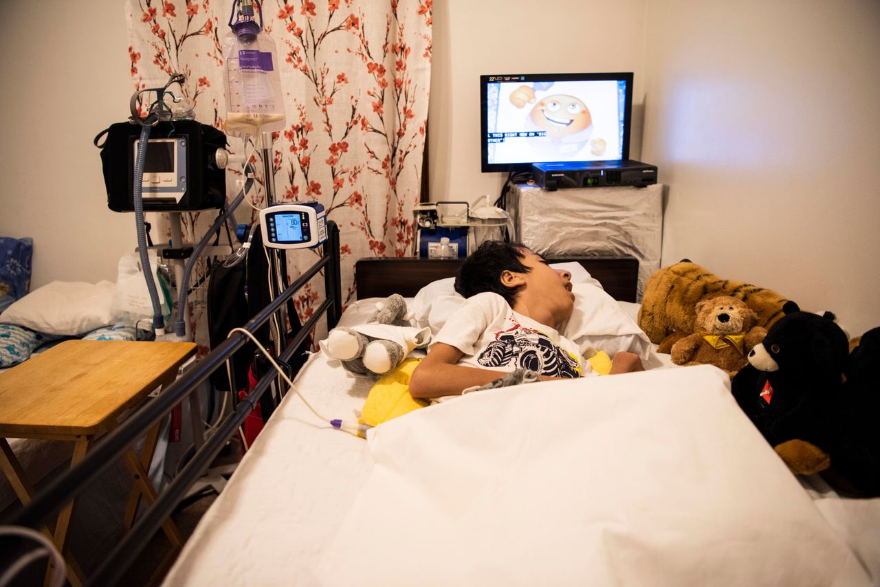 Noori's son Ahmad, 14, has spina bifida and needs 24-hour care.