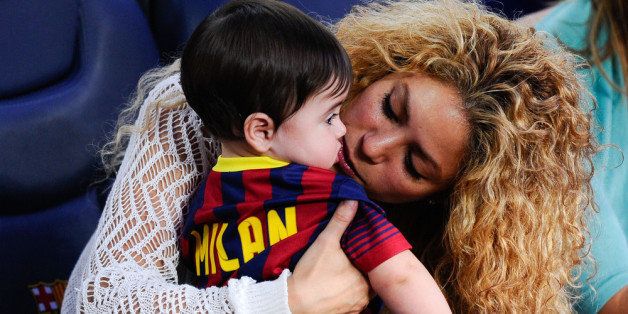 BARCELONA, SPAIN - SEPTEMBER 14: Shakira kisses to her son Milan prior to the La Liga match between FC Barcelona and Sevilla FC at Camp Nou on September 14, 2013 in Barcelona, Spain. (Photo by David Ramos/Getty Images)