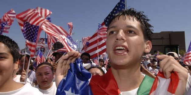 DALLAS - APRIL 9: Jorge Mendez chants with other protesters, 'Si Se Puede' or 'Yes, you can' during the Mega March on City Hall April 9, 2006 in Dallas, Texas. According to reports, an estimated half million Hispanics participated in the Mega March to peacefully protest immigration reform. (Photo by Jensen Walker/Getty Images)