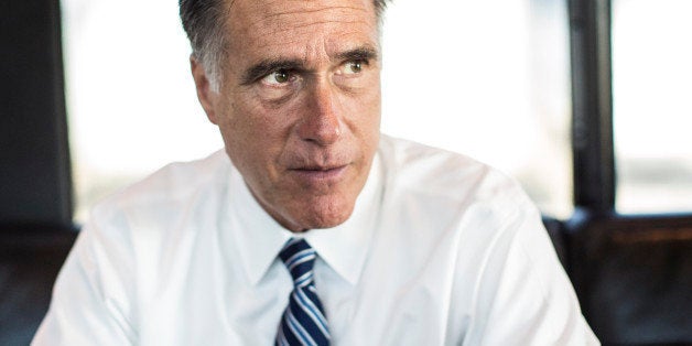 WORTHINGTON, OHIO - OCTOBER 25: Bound for a rally in central Ohio, Republican nominee for President Governor Mitt Romney aboard his campaign bus works with staff, in Worthington, Ohio, Thursday, October, 25, 2012. (Photo by Melina Mara/The Washington Post via Getty Images)