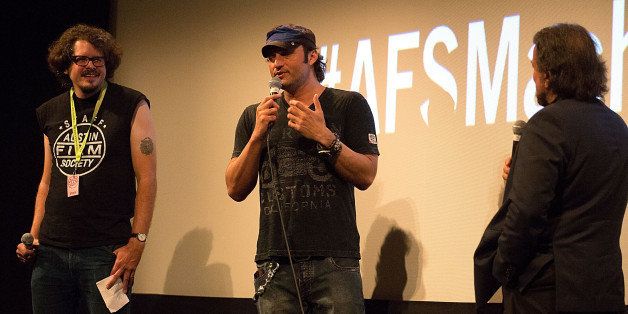 AUSTIN, TX - OCTOBER 01: Director Robert Rodriguez and actor Tom Savini speak on stage during the 'Machete Kills' Q&A presented by the Austin Film Society and Troublemaker Studios at The Paramount Theatre on October 1, 2013 in Austin, Texas. (Photo by Rick Kern/Getty Images)