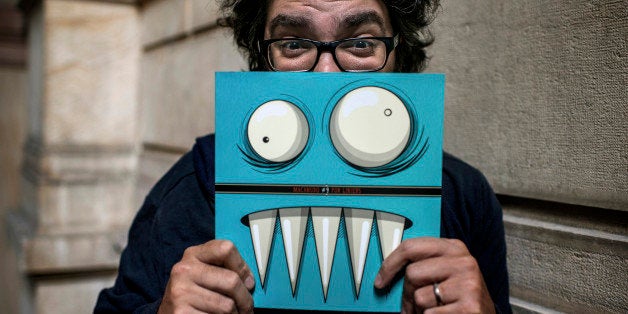 TO GO WITH AFP STORY BY JULIE PACOREL-MOUTTETArgentinian cartoonist Liniers poses on June 14, 2013 in Lyon during the International Cartoon Festival in the central French city. Liniers is the author of a comic strip, 'Macanudo', published in the daily Argentinian newspapaer La Nacion. AFP PHOTO / JEFF PACHOUD (Photo credit should read JEFF PACHOUD/AFP/Getty Images)