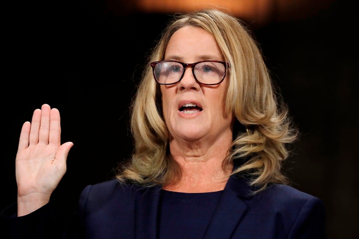 Christine Blasey Ford being sworn in to testify before the Senate Judiciary Committee about her sexual assault allegation aga