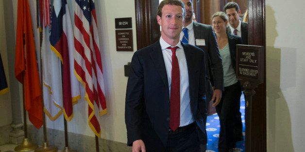 Mark Zuckerberg, founder and chief executive officer of Facebook Inc., leaves a meeting with members of the Senate Committee on Commerce, Science and Transportation in Washington, D.C., U.S., on Thursday, Sept. 19, 2013. Zuckerberg in April announced the formation of an advocacy group, Fwd.us, to push for more visas for skilled immigrant workers. He pressed that cause yesterday in a meeting with Senator Charles Schumer, a New York Democrat. Photographer: Andrew Harrer/Bloomberg via Getty Images 