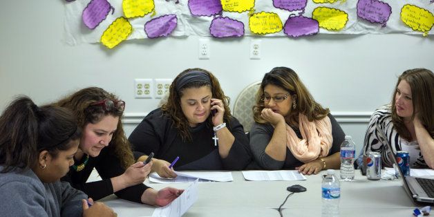 FAIRFAX, VA - OCT 25: Volunteers conduct a phone bank, for democratic candidate for delegate Richard Cabellos, in Fairfax, VA, October 25, 2013, at the SEIU headquarters. Latinos in Virginia are getting involved in current political campaigns as volunteers and supporters, even if they cannot vote. They make up a small part of the vote but can have influence in key districts. (Photo by Evelyn Hockstein/For The Washington Post via Getty Images)