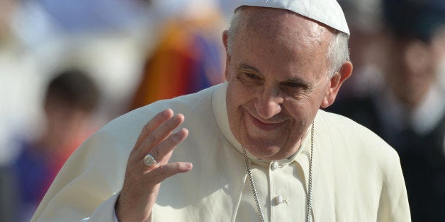 Pope Francis greets the crowd during his general audience at St Peter's square on October 30, 2013 at the Vatican. AFP PHOTO / GABRIEL BOUYS (Photo credit should read GABRIEL BOUYS/AFP/Getty Images)