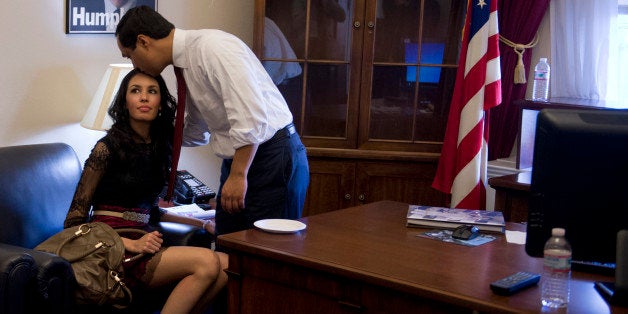 UNITED STATES - JANUARY 03: Freshman Rep. Joaquin Castro, D-Texas, hangs out in his Cannon Building office with his girlfriend Anna Flores, and his niece Carina, 3 1/2, daughter of his brother Julian Castro, Mayor of San Antonio, on the day the 113th Congress was sworn in. (Photo By Tom Williams/CQ Roll Call)