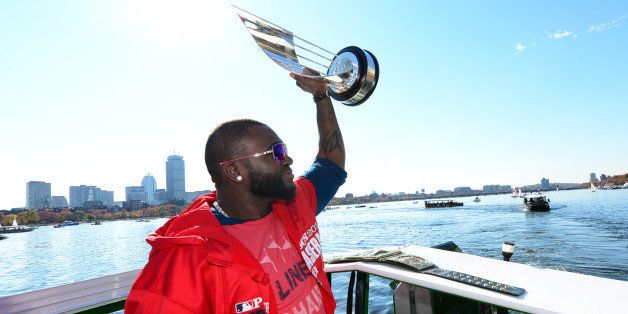 BOSTON, MA - NOVEMBER 2: David Ortiz #34 of the Boston Red Sox holds up his World Series MVP trophy during a victory parade on November 2, 2013 through Boston, Massachusetts. (Photo by Michael Ivins/Boston Red Sox/Getty Images)