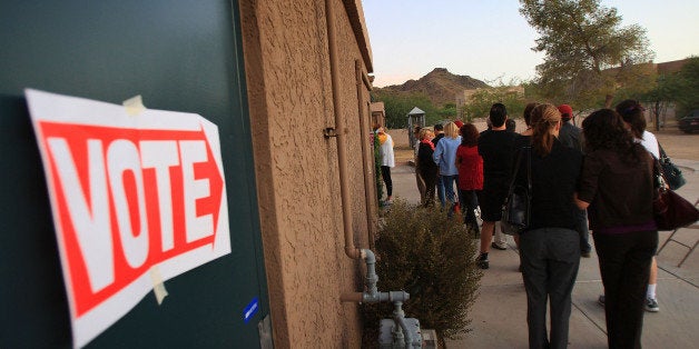 PHOENIX - NOVEMBER 4: Voters stand in line at their polling place at St. Stephen's Byzantine Catholic Church before dawn in the home state of Republican presidential nominee U.S. Sen. John McCain (R-AZ) November 4, 2008 in Phoenix, Arizona. Voting is underway in the U.S. presidential elections with Democratic presidential nominee Sen. Barack Obama (D-IL) leading in the polls against the Republican presidential nominee Sen. John McCain (R-AZ). (Photo by David McNew/Getty Images)