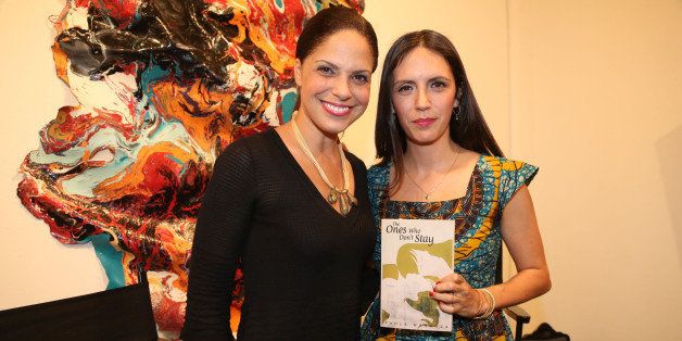 NEW YORK, NY - NOVEMBER 11: (L-R) Soledad O'Brien and Paola Mendoza attend the 'The Ones Who Don't Stay' Book Release Party at Rush Art Gallery on November 11, 2013 in New York City. (Photo by Johnny Nunez/WireImage)