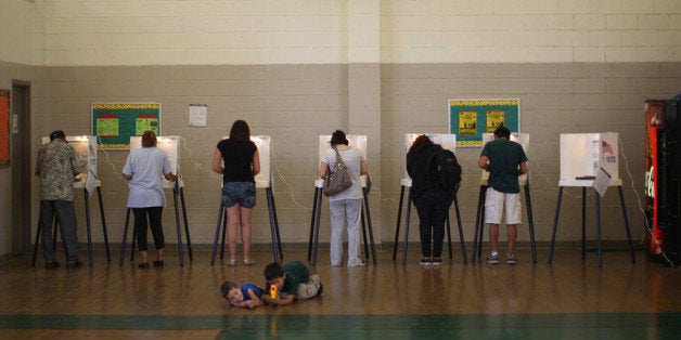 LOS ANGELES, CA - NOVEMBER 6: People vote at a school in the predominantly Latino Boyle Heights area during the U.S. presidential election on November 6, 2012 in Los Angeles, California. The election will decide whether Democrat Barack Obama serves a second term as president of the United States or is replaced by Republican rival, former Massachusetts Gov. Mitt Romney. (Photo by David McNew/Getty Images)