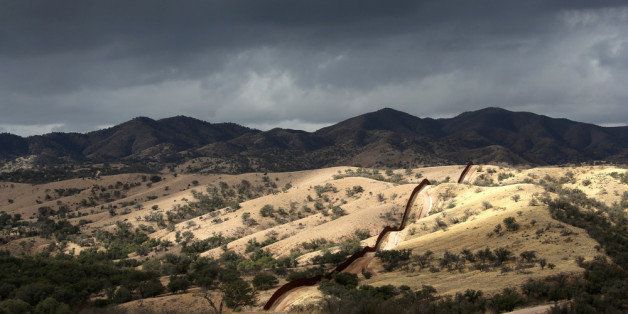 NOGALES, AZ - MARCH 08: The U.S.-Mexico border fence stretches into the countryside on March 8, 2013 near Nogales, Arizona. U.S. Border Patrol agents in Nogales say they have seen a spike in immigrants crossing into the United States from Mexico in the last week. (Photo by John Moore/Getty Images)