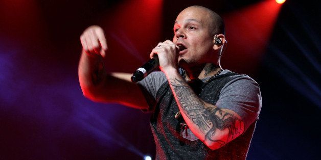 SAN JUAN, PUERTO RICO - DECEMBER 06: Rene of Calle 13 performs with Draco Rosa at Draco & Friends Concert at Coliseo de Puerto Rico on December 6, 2013 in San Juan, Puerto Rico. (Photo by GV Cruz/Getty Images)
