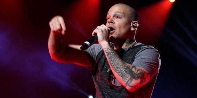 SAN JUAN, PUERTO RICO - DECEMBER 06: Rene of Calle 13 performs with Draco Rosa at Draco & Friends Concert at Coliseo de Puer