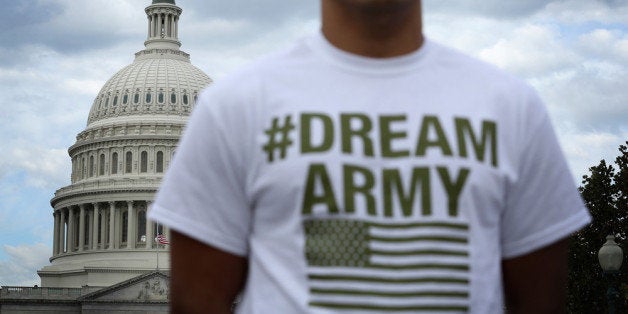 WASHINGTON, DC - OCTOBER 23: Lizardo Buleje of San Antonio, Texas, stands in front of the U.S. Capitol during a rally on imm
