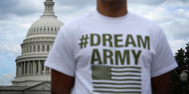 WASHINGTON, DC - OCTOBER 23: Lizardo Buleje of San Antonio, Texas, stands in front of the U.S. Capitol during a rally on immigration reform October 23, 2013 on Capitol Hill in Washington, DC. The Dream Action Coalition held a rally and briefing to discuss 'how the outdated immigration system undermines military readiness, separates military families, and prevents talent from joining its enlisted and officer ranks.' (Photo by Alex Wong/Getty Images)