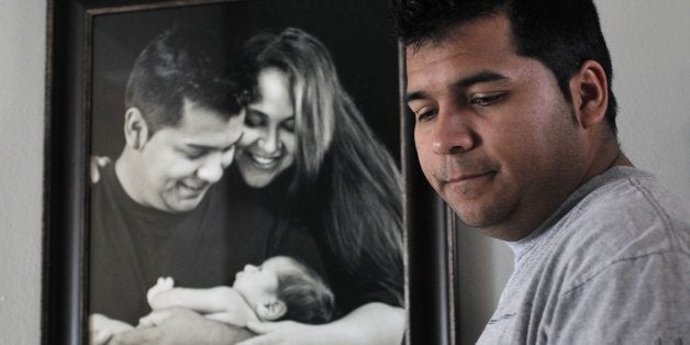 Erick Munoz, the husband of Marlise Machado Munoz, poses for a photo at his home on Jan. 3, 2014. Attorneys are preparing leg