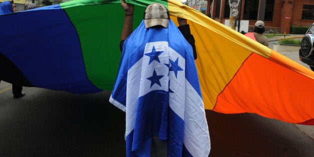 Members of the Arcoiris (Rainbow) Lesbian, Gay, Transsexual and Bisexual (LGTB) Association, demonstrate on the International Day against Homophobia in the streets of Tegucigalpa, on May 17, 2010. AFP PHOTO/Orlando SIERRA (Photo credit should read ORLANDO SIERRA/AFP/Getty Images)