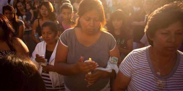 ANAHEIM, CA - JULY 29: Local residents gather for a candle light vigil for Manuel Angel Diaz, 25, on July 29, 2012 in Anaheim, California. Diaz was fatally shot July 21 by an Anaheim police officer and has sparked days of protests by the angered community. (Photo by Jonathan Gibby/Getty Images)