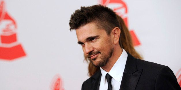 Juanes arrives at the Latin Recording Academy Person of the Year tribute on Wednesday, Nov. 20, 2013, in Las Vegas. (Photo by Chris Pizzello/Invision/AP)
