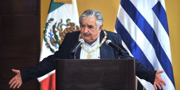 Uruguayan President Jose Mujica delivers a speech after being decorated with the Aztec Eagle Order by Mexican President Enrique Pena Nieto, on January 28, 2014 in Havana. Pena Nieto and Mujica are in Cuba to participate in the Second Summit of the Community of Latin American and Caribbean States (CELAC). AFP PHOTO/YAMIL LAGE (Photo credit should read YAMIL LAGE/AFP/Getty Images)