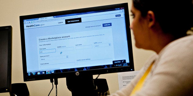 Samantha Guzman, an Affordable Care Act navigator with the Bureau and Putnam County Health Department, helps Jackie Karns, no