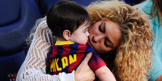 BARCELONA, SPAIN - SEPTEMBER 14: Shakira kisses to her son Milan prior to the La Liga match between FC Barcelona and Sevilla FC at Camp Nou on September 14, 2013 in Barcelona, Spain. (Photo by David Ramos/Getty Images)