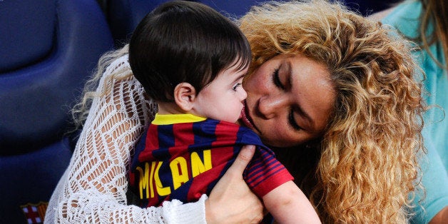 BARCELONA, SPAIN - SEPTEMBER 14: Shakira kisses to her son Milan prior to the La Liga match between FC Barcelona and Sevilla