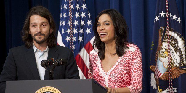 Director Diego Luna and actress Rosario Dawson speak prior to a screening of their film, 'Cesar Chavez,' at the Eisenhower Executive Office Building adjacent to the White House in Washington, DC, March 19, 2014. The movie, starring Michael Pena, John Malkovich, America Ferrera and Dawson, directed by Luna, tells the story of the life of Cesar Chavez, a labor leader and civil rights activist. AFP PHOTO / Saul LOEB (Photo credit should read SAUL LOEB/AFP/Getty Images)