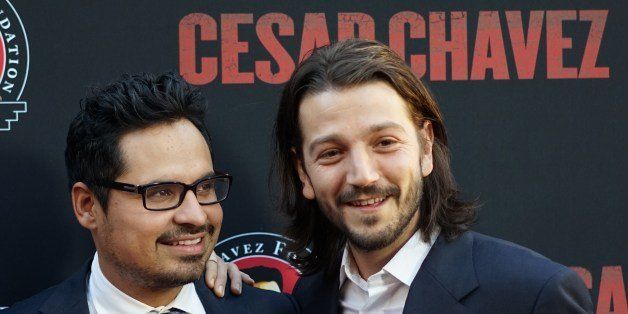 Actors Diego Luna (R) and Michael Pena (L) attend the premiere of Pantelion Films and Participant Media's 'Cesar Chavez' at TCL Chinese Theatre on March 20, 2014 in Hollywood, California. AFP PHOTO/Joe KLAMAR (Photo credit should read JOE KLAMAR/AFP/Getty Images)