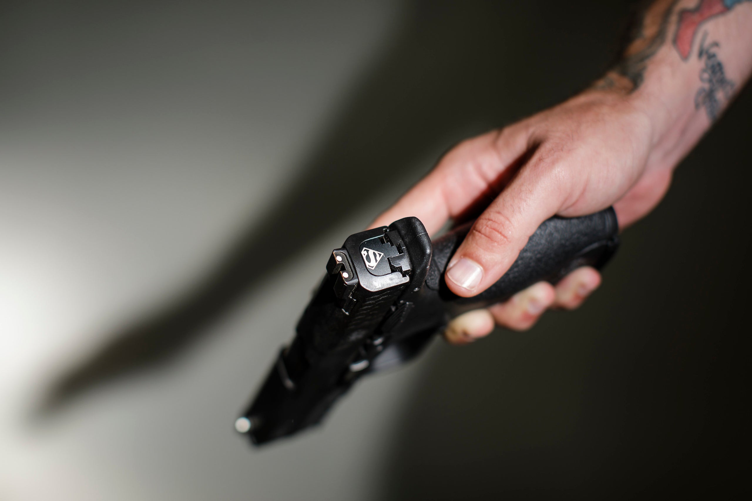 Hooper's .40 caliber handgun has a custom Superman logo.