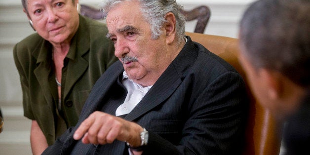 Jose Mujica Cordano, Uruguay's president, center, speaks during a bilateral meeting with U.S. President Barack Obama, right,