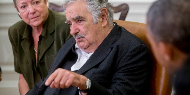 Jose Mujica Cordano, Uruguay's president, center, speaks during a bilateral meeting with U.S. President Barack Obama, right, in the Oval Office of the White House in Washington, D.C., U.S., on Monday, May 12, 2014. Obama and Mujica discussed ways to grow bilateral economic ties and expand collaboration on science, technology, and health. Photographer: Andrew Harrer/Bloomberg via Getty Images 