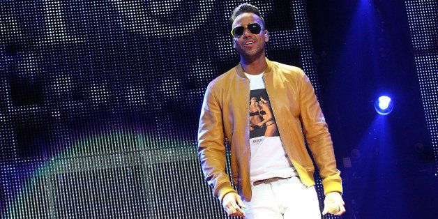 LOS ANGELES, CA - MAY 22: Singer Romeo Santos performs on stage at Staples Center on May 22, 2014 in Los Angeles, California. (Photo by JC Olivera/Getty Images)