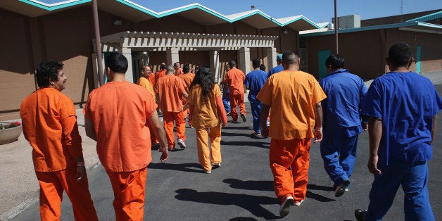 FLORENCE, AZ - FEBRUARY 28: Immigrant detainees walk through the Immigration and Customs Enforcement (ICE), detention facility on February 28, 2013 in Florence, Arizona. With the possibility of federal budget sequestration, ICE released 303 immigration detainees in the last week from detention facilities throught Arizona. Most detainees typically remain in custody for several weeks before they are deported to their home country, while others remain for longer periods while their immigration cases work through the courts. (Photo by John Moore/Getty Images)