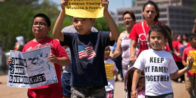WASHINGTON, DC - JULY 07: Young children join immigration reform protesters while marching in front of the White House July 7, 2014 in Washington, DC. During the rally participants condemned 'the President's response to the crisis of unaccompanied children and families fleeing violence and to demand administrative relief for all undocumented families'. (Photo by Win McNamee/Getty Images)
